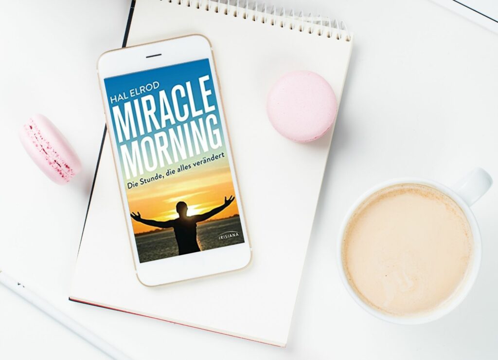 Ein Bild von einem Handy, dass das Cover von Hal Elrods Buch Miracle Morning zeigt. Es deutet auf unsere kompakte Zusammenfassung hin.